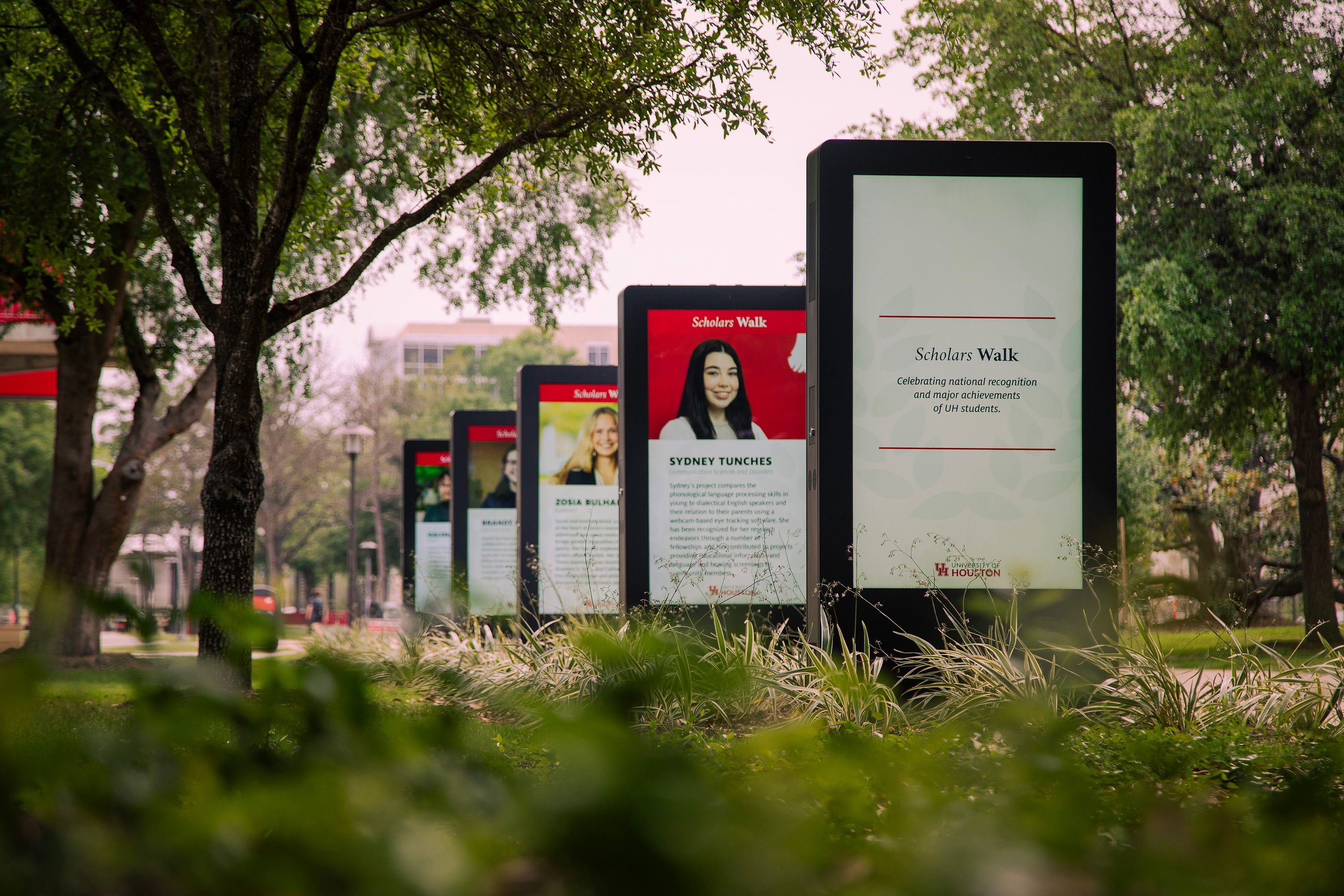 digital screens with text and images of students